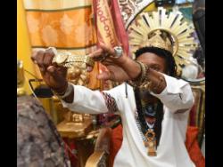 LA Lewis flashes what he says is a million-dollar timepiece.