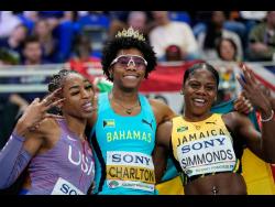 Devynne Charlton of Bahamas poses with Alia Armstrong (left) of the United States and Megan Simmonds of Jamaica, after winning the gold medal in the women’s 60 metres hurdles final at the World Athletics Indoor Championships in Torun, Poland, on Sunday.