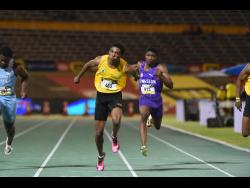 Excelsior High School’s Riquelme Reid dips at the line to win the Class One boys’ 100m final at the ISSA/GraceKennedy Boys and Girls’ Athletics Championships at the National Stadium in Kingston on Wednesday, March 25, 2026.