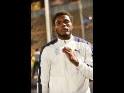 Credit: Ian Allen Joseph Salmon of Jamaica College reacts after breaking the discus record on the third day of the ISSA GraceKennedy Boys and Girls’ Athletics Championships at the National Stadium on Thursday.