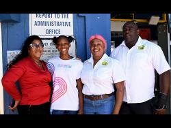 Sprint sensation Shanoya Douglas (second left) with (from left) her grandaunt and guardian, Jacqueline Blake, and her cousins, Keitha-Gaye Mordecai and Courtney McIntosh, during celebrations hosted by Holland High School in recognition of her Class One sprint double success at the 2026 ISSA GraceKennedy Boys and Girls’ Athletics Championships.
