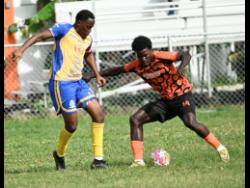 Credit: Ricardo Makyn Harbour View FC’s Trayvone Reid (left) and Tivoli Gardens FC’s Denville Watson challenge for the ball during the Jamaica Premier League football match at the Edward Seaga Sports Complex on Sunday.