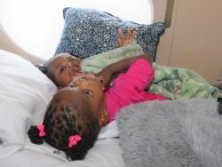 Conjoined twins Azora and Azaria Elson are pictured aboard a Medevac aircraft at Norman Manley International Airport, ahead of their departure to Saudi Arabia for life-changing separation surgery.