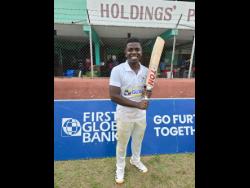 St Jago captain Vitel Lawes is all smiles after leading his side to the First Global Bank Grace Shield title in a game against Campion College at Melbourne Cricket Oval yesterday.