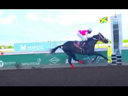 RIDEALLDAY, ridden by Ian Spence, wins the sixth running of the Ian Levy Cup in a track record 1:41:8 seconds at Caymanas Park yesterday.