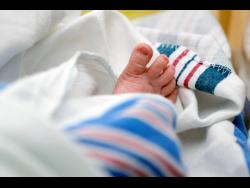 The toes of a newborn baby.