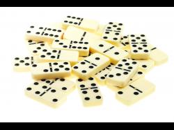 pile of scattered dominoes on isolated white background