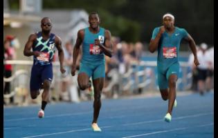 Aaron Brown (right) races to the win ahead of Jerome Blake (centre) who finished second, and Bismark Boateng, who finished seventh, during the men’s 100m at the Canadian Track and Field Championships in Langley, British Columbia on Saturday, June 25.