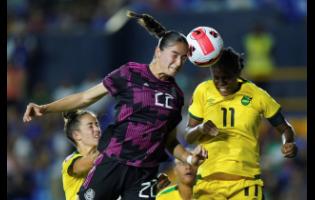 Jamaica's Khadija Shaw (right) and Mexico's Diana Ordonez battle for the ball during their Concacaf Women's Championship match in Monterrey, Mexico on Monday night.