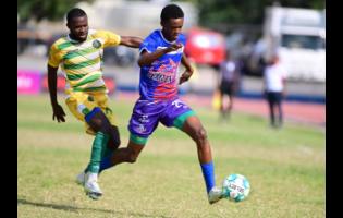 Shakeon Satchwell  (right) of Portmore United  dribbles away from Kemmoy Phillips of Vere United  during a  Jamaica Premier League match at Ashenheim Stadium, Jamaica College  on Sunday, February 26, 2023. Portmore won 2-0.