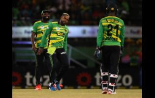 Fabian Allen (centre) of Jamaica Tallawahs celebrates after getting the wicket of Roston Chase of St Lucia Kings during the Republic Bank Caribbean Premier League T20 eliminator match between Saint Lucia Kings and Jamaica Tallawahs at Providence Stadium in Georgetown, Guyana, last night.