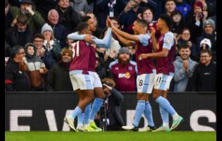 Aston Villa’s Leon Bailey (left) celebrates with teammates after scoring their fourth goal during the English Premier League match against Nottingham Forest at the Villa Park stadium in Birmingham, England, on Saturday. Villa won 4-2.