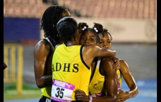 Alphansus Davis High School members celebrate their victory in the Open girls’ 4x800 metres in 9:02.83 minutes at the Gibson/McCook Relays at the National Stadium on Saturday.