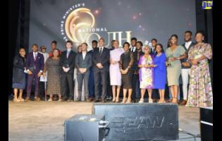 Prime Minister Andrew Holness (sixth left), and Minister of Education and Youth Fayval Williams (sixth right), are flanked by recipients of the Prime Minister Youth Award for Excellence 2022, at the awards ceremony held at Jamaica House.