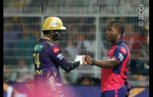 Former West Indies spinner-turned-all-rounder, Sunil Narine (left) is greeted by West Indies captain Rovman Powell after the former slammed a century for the Kolkata Knight Riders against the Rajasthan Royals in the Indian Premier League yesterday.  