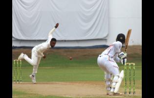 Jamaica Scorpions debutant Andre McCarthy (left) bowls to Trinidad and Tobago Red Force opener Cephas Cooper during the opening day of their West Indies Championship final-round match at Sabina Park yesterday. 