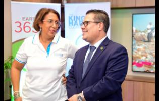 Minister without Portfolio in the Ministry of Economic Growth and Job Creation, Senator Matthew Samuda, converses with CEO of GraceKennedy Foundation, Caroline Mahfood, during Monday’s media launch of The Great Mangrove Clean-up, held at GraceKennedy Limited on Harbour Street in Kingston.