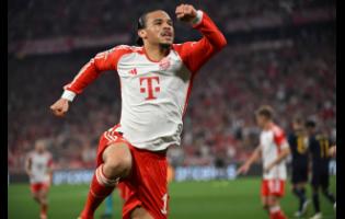 Bayern Munich’s Leroy Sane celebrates after scoring his team’s first goal during the Champions League semifinal first leg match between FC Bayern Munich and Real Madrid in Munich, Germany yesterday. The game ended in a 2-2 draw. 