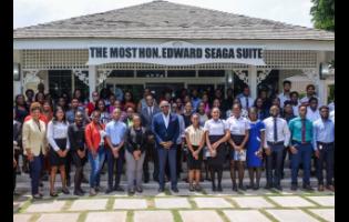 Minister of Tourism, Edmund Bartlett (centre), with tourism officials, representatives of companies and interns who participated in the 2023 Tourism Enhancement Fund Summer Internship Programme.