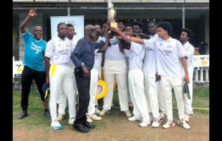 Bridgeport’s members celebrate winning their third consecutive Jamaica Energy Partner 40-over St Catherine cricket title with St Catherine Cricket Association President Milholland Barker (fourth left) after a 72-run victory over Old Harbour in the final at Port Esquivel recently.