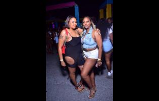 Sandy Unstoppable (left) and her sister Shawn chilling out at 90s Pon Di Wharf, held recently at Newport Commercial Centre, Newport West, Kingston. 