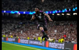 Bayern Munich’s Alphonso Davies celebrates after scoring during yesterday’s Champions League semi-final second-leg football match at the Santiago Bernabeu stadium in Madrid, Spain. Madrid won 2-1 to advance to the final 4-3 on aggregate.