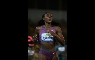 United States of America's Alexis Holmes eases after winning the women's 400 metres at the Jamaica Invitational at the National Stadium tonight.