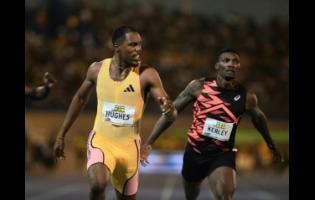 Great Britain's Zharnel Hughes (left) wins the men's 200 metres ahead of the United States of America's Fred Kirley at the National Stadium tonight.