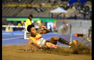 Jamaica's Shanieka Ricketts executes her first jump in the women’s triple jump during the Jamaica Athletics Invitational at the National Stadium tonight.