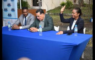 Minister of Legal and Constitutional Affairs, Marlene Malahoo Forte (right), along with Minister of State in the Office of the Prime Minister (West), Homer Davis (centre), and Mayor of Montego Bay and Chairman of the St James Municipal Corporation, Councillor Richard Vernon, in attendance at a recent Bogue Village community meeting.