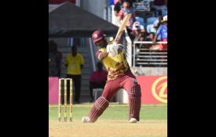 West Indies opener Johnson Charles drives through the offside during his attacking 69 off 26 balls in the third T20 International match against South Africa at Sabina Park yesterday. 