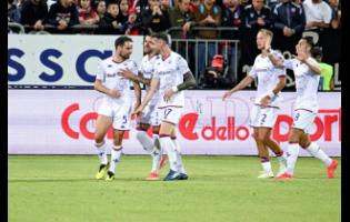 Fiorentina’s midfielder Giacomo Bonaventura (left) scores a goal and celebrates with his team during the Italian Serie A match between Cagliari Calcio and Fiorentina at the Unipol Domus in Cagliari, Italy on Thursday, May 23, 2024. 
