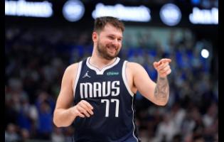 Dallas Mavericks guard Luka Doncic (77) reacts to a play during the second half in Game 3 of the NBA basketball Western Conference finals against the Minnesota Timberwolves, Sunday, May 26, 2024, in Dallas. 