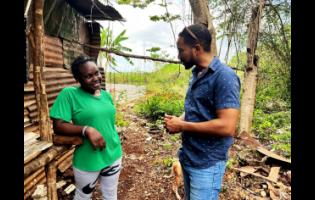 Livestock specialist with the Improving Rural Livelihoods through Resilient Agrifood Systems Project of the FAO, Cabrini Edwards (right), in dialogue with one of the beneficiaries of the project, Roxanne Robinson, in Kitson Town, St Catherine.