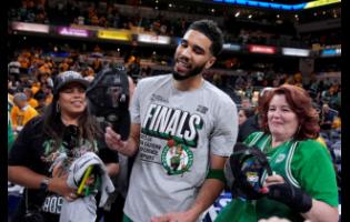 Boston Celtics forward Jayson Tatum celebrates after Game 4 of the NBA Eastern Conference basketball finals against the Indiana Pacers on Monday in Indianapolis. The Celtics won 105-102.