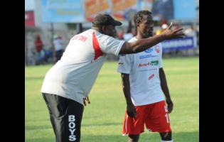 Andrew Price, then Boys’ Town coach, issues instructions to Rafiek  Thomas during a Jamaica Premier League match at Boys’ Town. Price said he was devastated by the player’s passing.