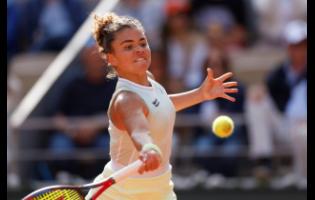 Italy’s Jasmine Paolini plays a shot against Russia’s Mirra Andreeva during their semifinal match of the French Open tennis tournament at the Roland Garros stadium in Paris yesterday.