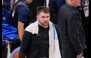 Dallas Mavericks guard Luka Doncic heads to the lockers after Game 3 of the NBA basketball finals against the Boston Celtics, Wednesday, June 12, 2024, in Dallas. The Celtics won 106-99. 