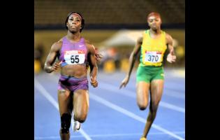 Shelly Ann Fraser-Pryce (left), wins the women’s 100 metres at the JAAA’s third staging of the French Foray at the National Stadium on Saturday. Also in the photograph is Briana Campbell of St Jago High School.