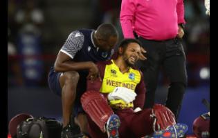 West Indies opener Brandon King displays some discomfort after he suffered an injury while batting against England during their T20 World Cup Super Eight match in St Lucia last night. 