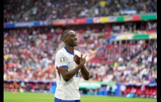Randal Kolo Muani celebrates after France scored  during a round-of-16 match between France and Belgium at the Euro 2024 football tournament in Duesseldorf, Germany, yesterday.