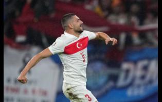 Turkey’s Merih Demiral celebrates after scoring his side’s second goal during a round-of-16 match between Austria and Turkey at the Euro 2024  football tournament in Leipzig, Germany, yesterday.