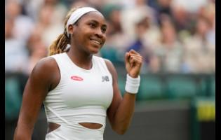 Coco Gauff of the United States reacts after defeating Anca Todoni of Romania in their match on day three at the Wimbledon tennis championships in London yesterday.