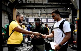 Jamaican throwers Traves Smikle (left), Rajindra Campbell (centre) and Roje Stona arrive at Gare de l’Est in Paris, France, along with other members of the Jamaica track and field team and coaching staff, on Wednesday. The team arrived in Paris following a training camp in Stuttgart, Germany.