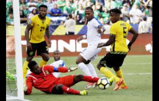 Jamaica’s goalkeeper Andre Blake (No.1) uses his foot to clear the ball during a Concacaf Gold Cup soccer match against Curacao in San Diego, California.