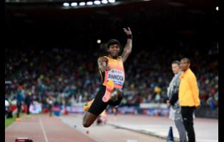 Jamaica’s long jumper Wayne Pinnock in action at the Zurich Diamond League in Switzerland yesterday. Pinnock won the event with a leap of 8.18 metres. 