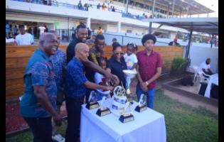 Connections of COMEHOMETOME, ridden by Tevin Foster, celebrate its victory in the ninth race, The Winston “Fanna” Griffiths OD Classic over 9 1/2 furlongs at Caymanas Park on Sunday. The event was a three-year-old and upwards Graded Stakes.