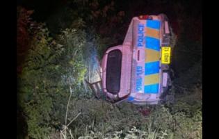 The police service vehicle that overturned along the York Town main road in Clarendon on Sunday evening.