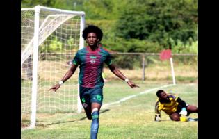 Montego Bay United’s Jordan Britto runs off in celebration after putting his team ahead against Vere United during their Jamaica Premier League encounter at the Wembley Centre of Excellence yesterday. Goalkeeper Mikhail Harrison looks on. MoBay United won 4-1.