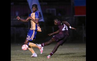 Harbour View defender Garth Stewart looks on helplessly as Chapelton Maroons’ Nathaniel Howe shoots and scores the winner during the Jamaica Premier League football match at Anthony Spaulding Sports Complex on Monday. Chapelton Maroons won 2-1.